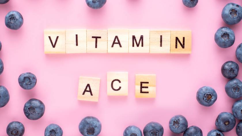 Vitamin word  A C E B on pink background